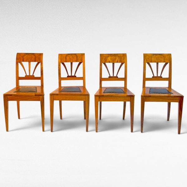 A set of four antique Austrian Empire walnut chairs, early 19thC